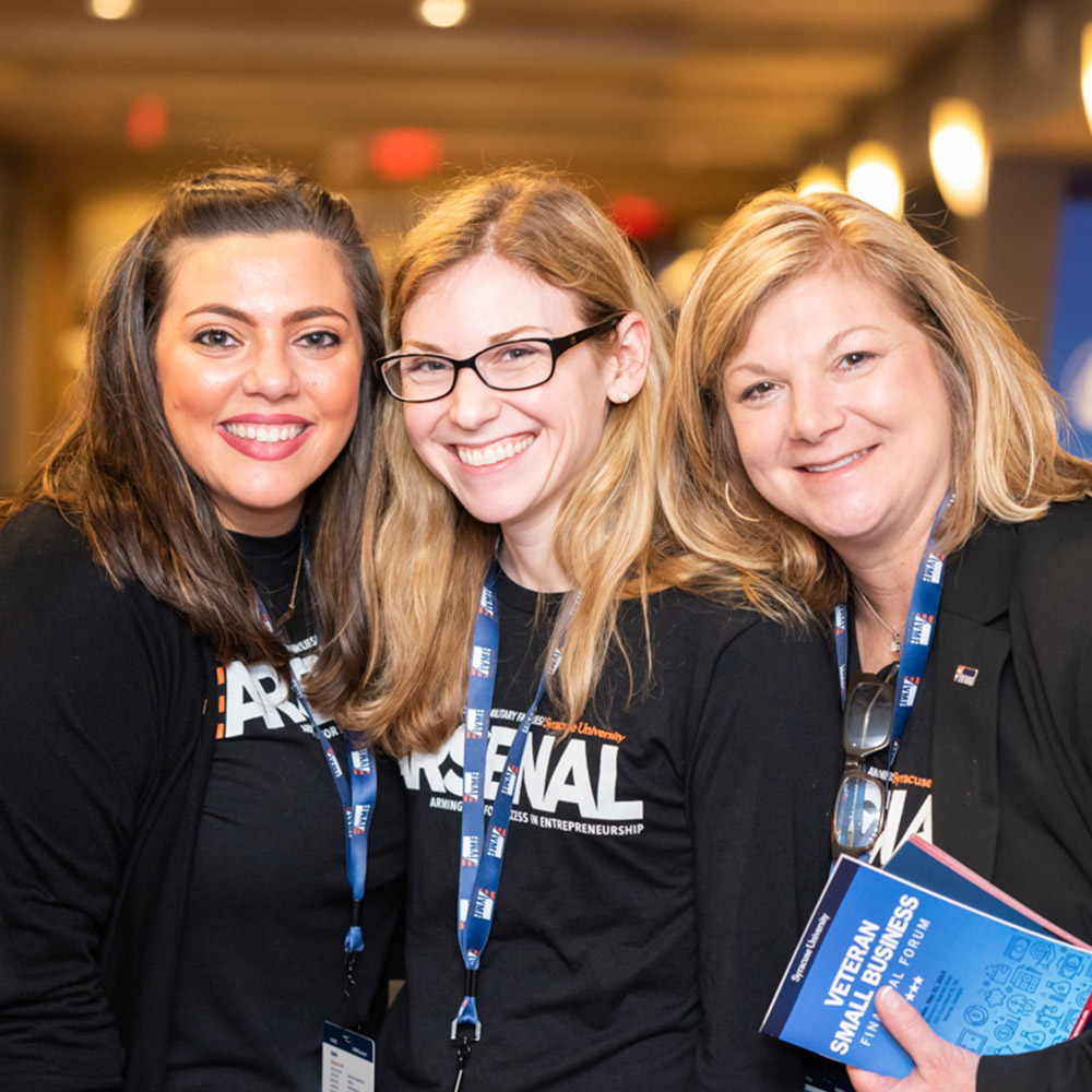 Three IVMF employees posing at Veteran EDGE conference.