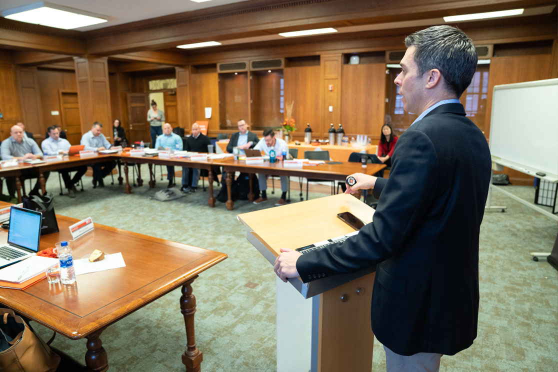 Speaker presenting to veterans training for politics.